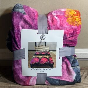 Golden Linen Queen size flannel blanket with a floral design. New